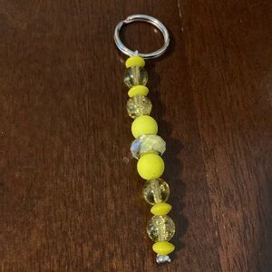 A yellow beaded keychain